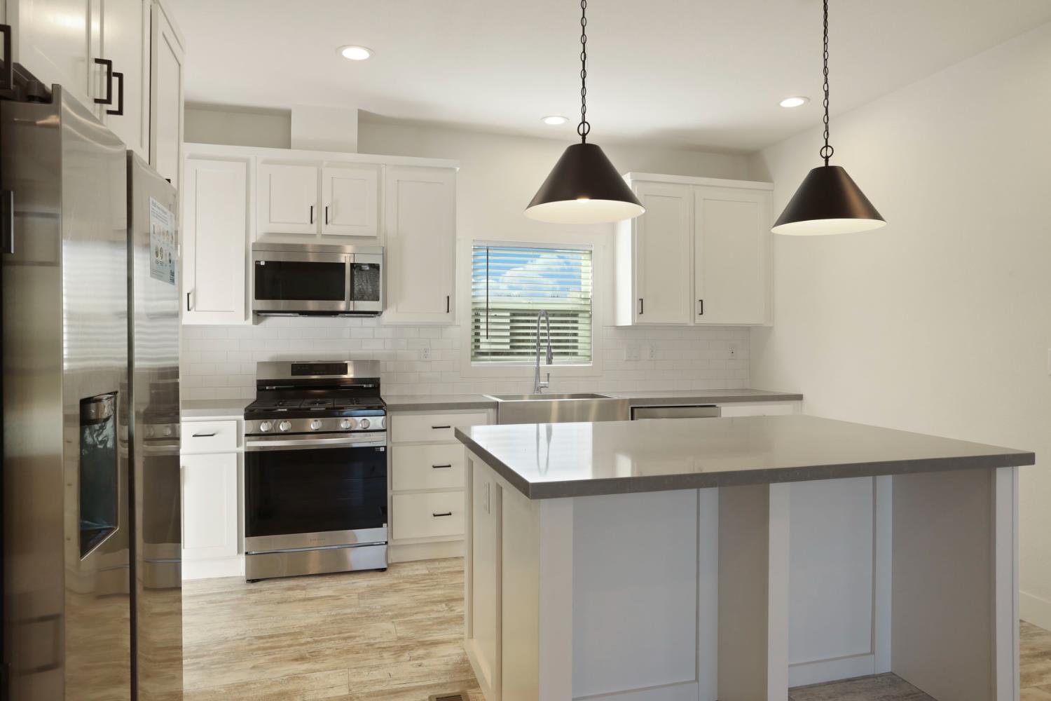 7680 Middle Bar Road Jackson, CA 95642 - Photo 24 of 58 a kitchen with a sink stove and refrigerator