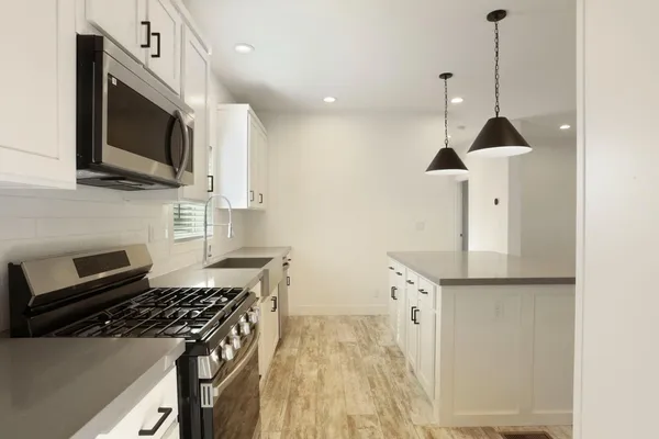 a view of an empty room with a bathroom