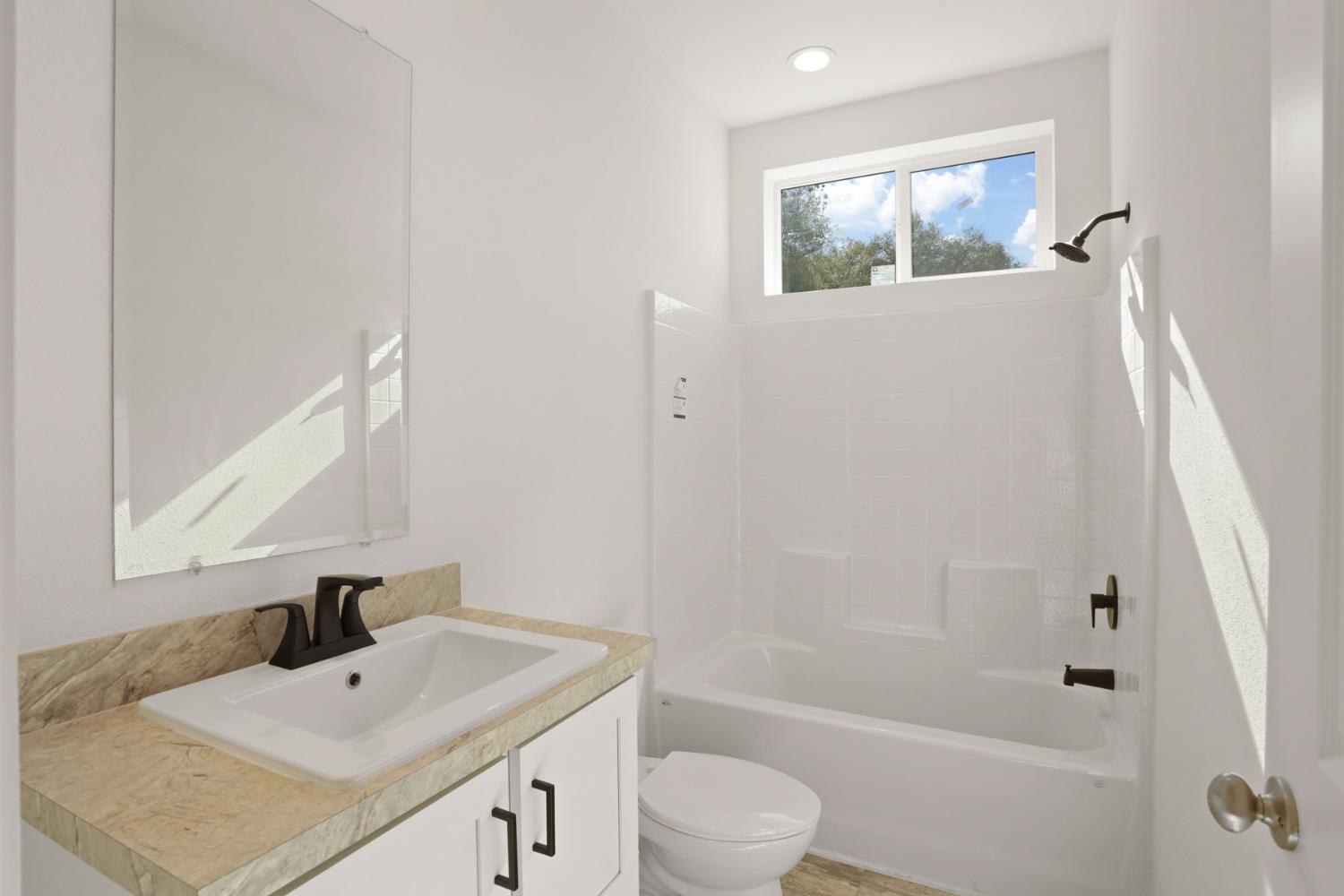 7680 Middle Bar Road Jackson, CA 95642 - Photo 29 of 58 a bathroom with a sink a toilet and shower