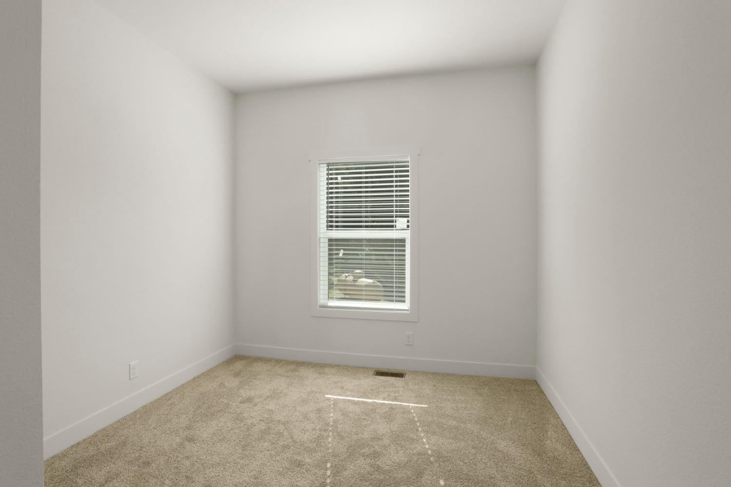 7680 Middle Bar Road Jackson, CA 95642 - Photo 32 of 58 an empty room with a window