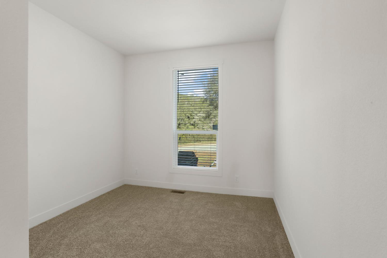 7680 Middle Bar Road Jackson, CA 95642 - Photo 33 of 58 an empty room with a window