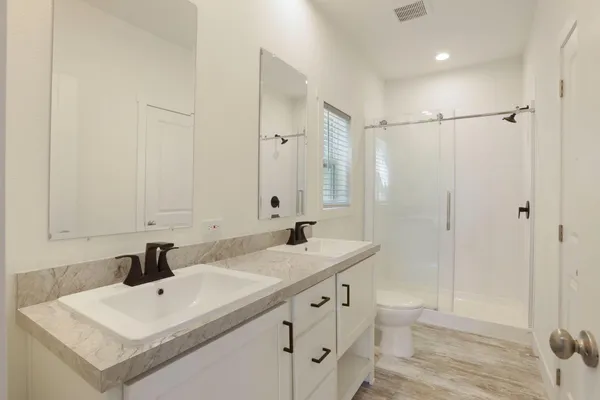 a view of a yard with large trees