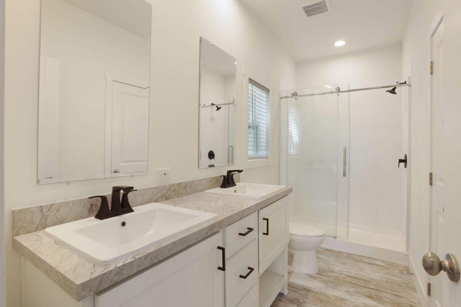 7680 Middle Bar Road Jackson, CA 95642 - Photo 38 of 58 a bathroom with a sink a toilet and a mirror