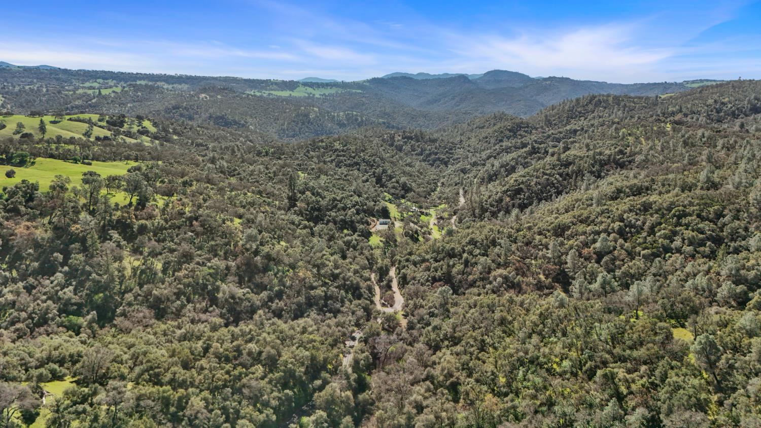 7680 Middle Bar Road Jackson, CA 95642 - Photo 4 of 58 a view of a lush green hillside and a mountain