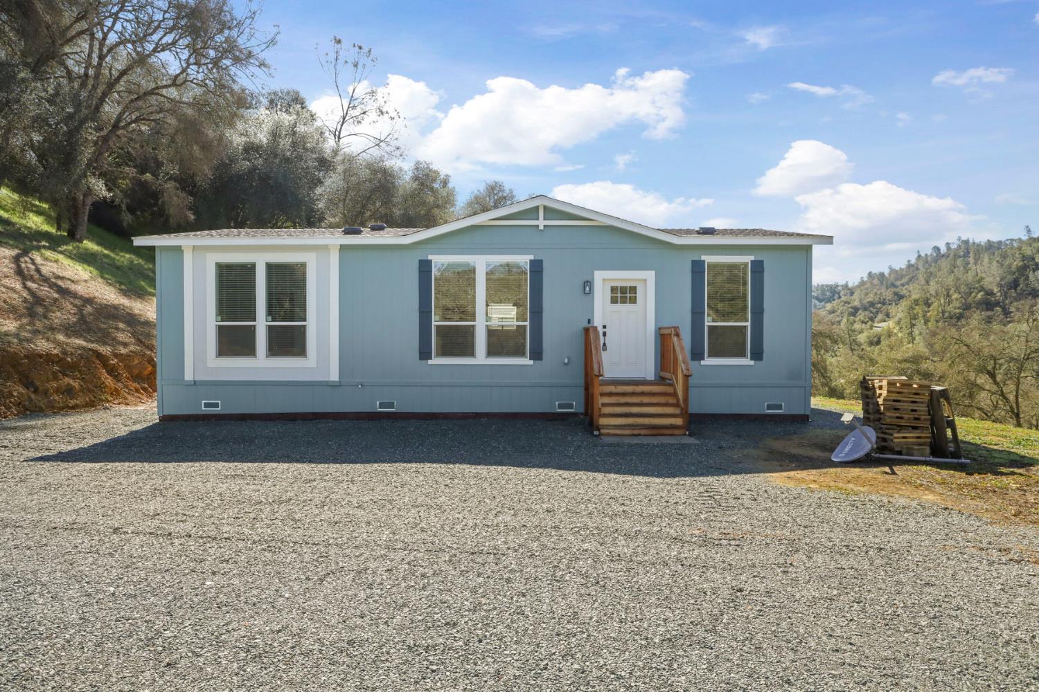 7680 Middle Bar Road Jackson, CA 95642 - Photo 47 of 58 front view of a house with a yard