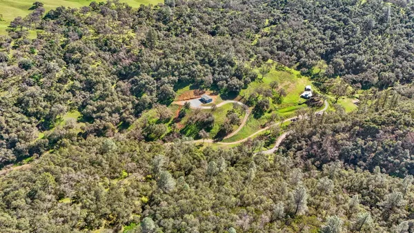 a view of a city with mountains in the background