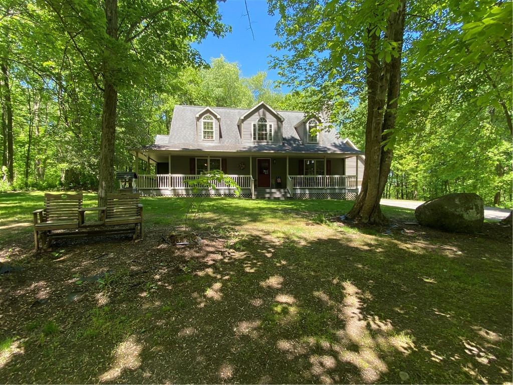 299 Vickerman Road Mercer, PA 16137 - Photo 4 of 38 a front view of a house with a yard table and chairs