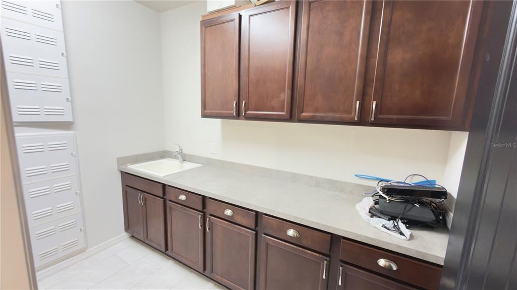 7360 Pool Compass Loop Wesley Chapel, FL 33545 - Photo 13 of 54 a bathroom with a sink and a mirror