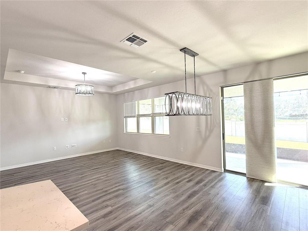 7360 Pool Compass Loop Wesley Chapel, FL 33545 - Photo 19 of 54 a view of empty room with wooden floor and fan
