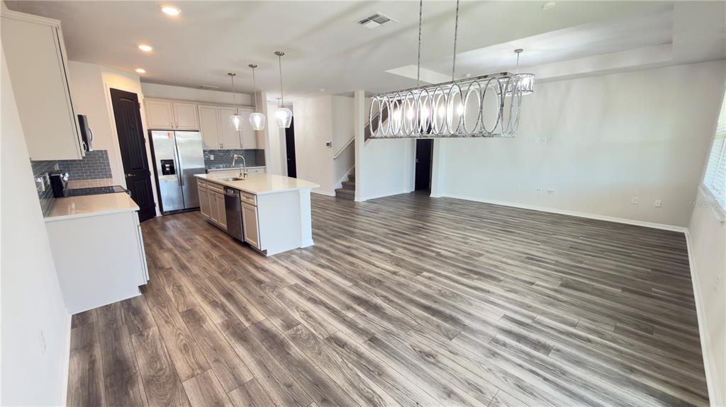 7360 Pool Compass Loop Wesley Chapel, FL 33545 - Photo 27 of 54 a view of a kitchen and utility room
