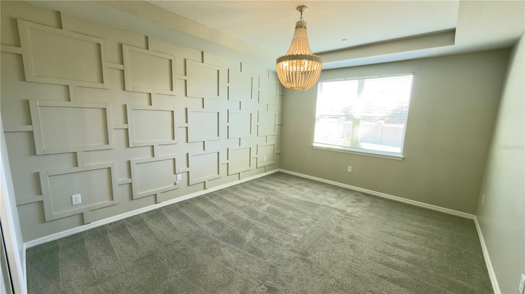 7360 Pool Compass Loop Wesley Chapel, FL 33545 - Photo 32 of 54 a view of an empty room with a window