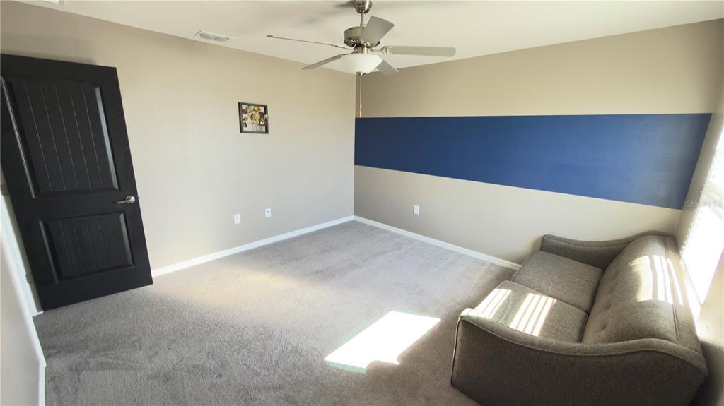 7360 Pool Compass Loop Wesley Chapel, FL 33545 - Photo 37 of 54 a view of an empty room with a window