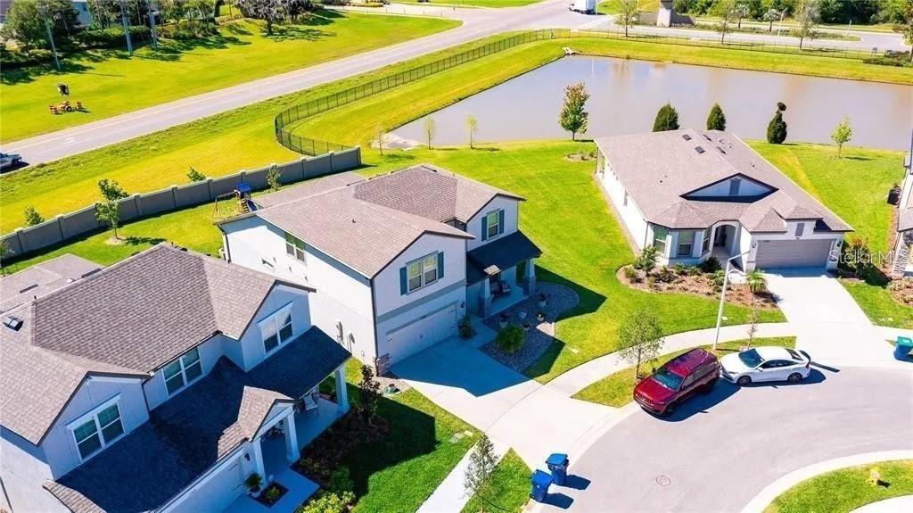 7360 Pool Compass Loop Wesley Chapel, FL 33545 - Photo 6 of 54 an aerial view of a house with a swimming pool yard and outdoor seating