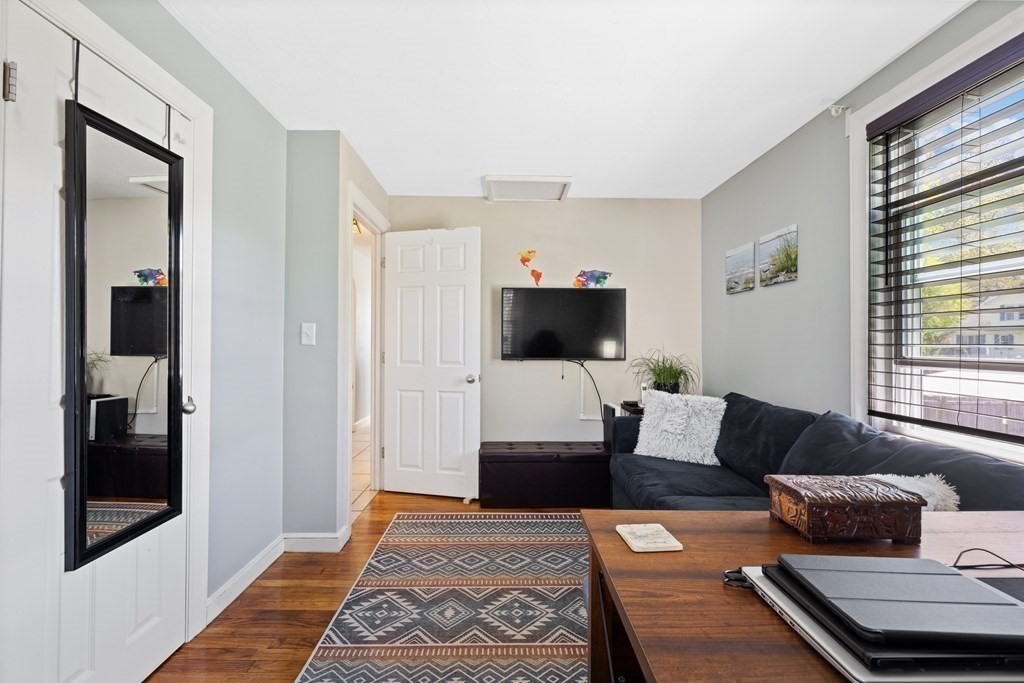 3 Pine Road Randolph, MA 02368 - Photo 11 of 30 a living room with furniture and a flat screen tv