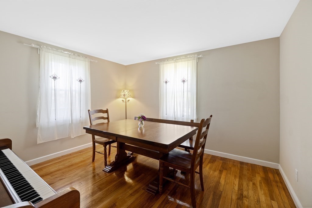 3 Pine Road Randolph, MA 02368 - Photo 12 of 30 a view of a dining room with furniture and wooden floor