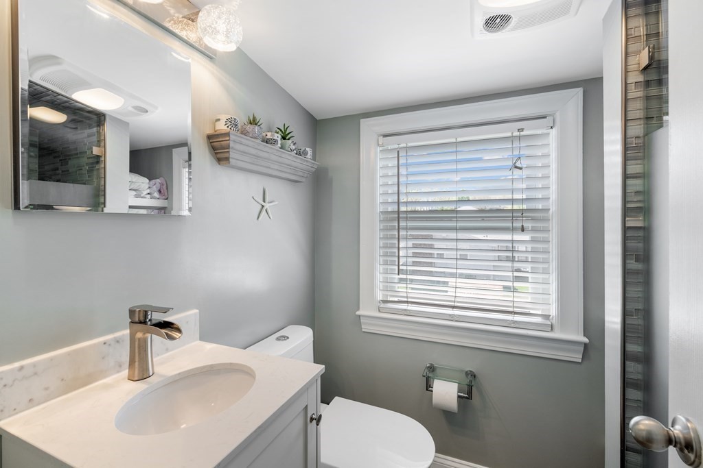 3 Pine Road Randolph, MA 02368 - Photo 16 of 30 a bathroom with a toilet sink and mirror