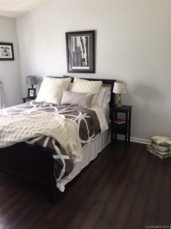 745 Shellstone Place, Unit 83 Fort Mill, SC 29708 - Photo 13 of 20 a bedroom with a bed and wooden floor