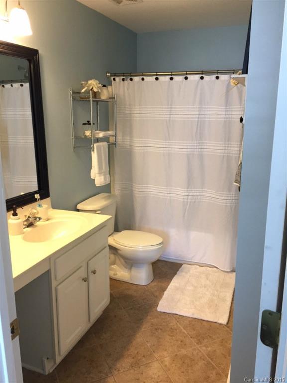 745 Shellstone Place, Unit 83 Fort Mill, SC 29708 - Photo 15 of 20 a bathroom with a granite countertop sink toilet and shower