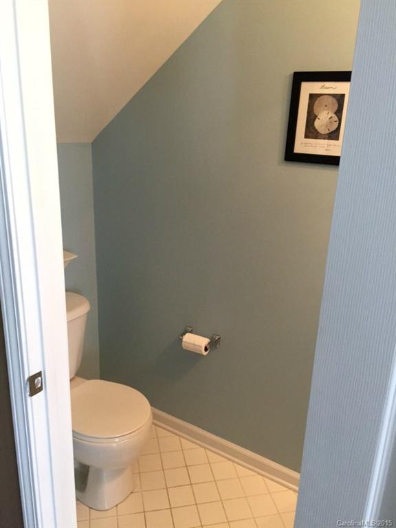745 Shellstone Place, Unit 83 Fort Mill, SC 29708 - Photo 9 of 20 a white toilet sitting next to a shower