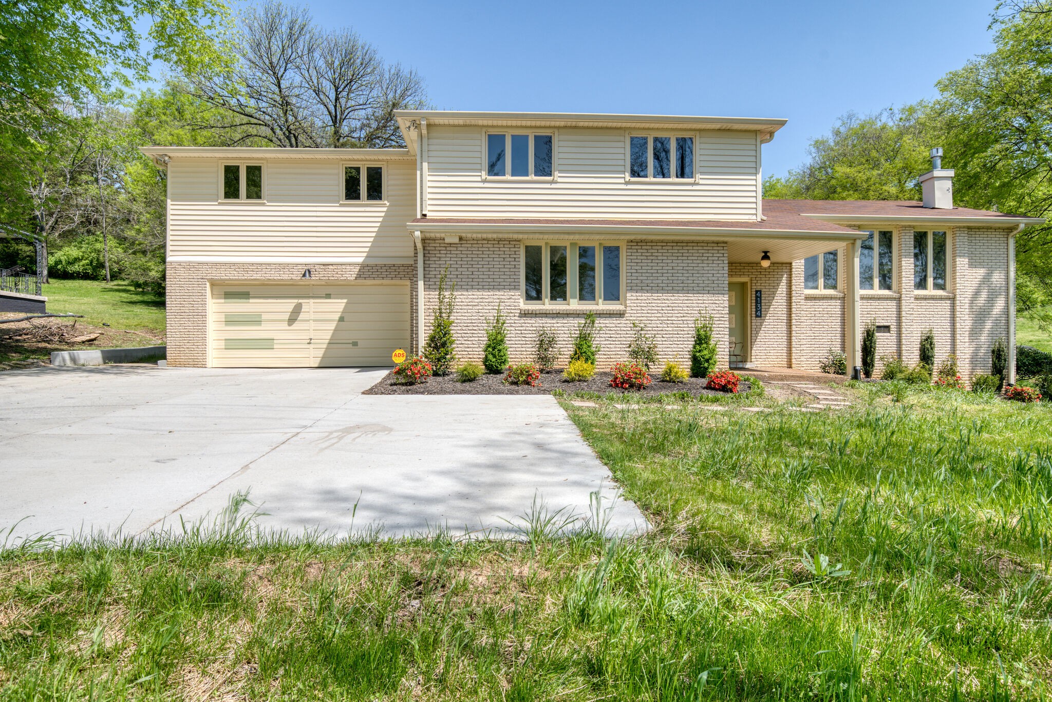 4134 West Hamilton Road Nashville, TN 37218 - Photo 1 of 35 a front view of a house with a yard and trees