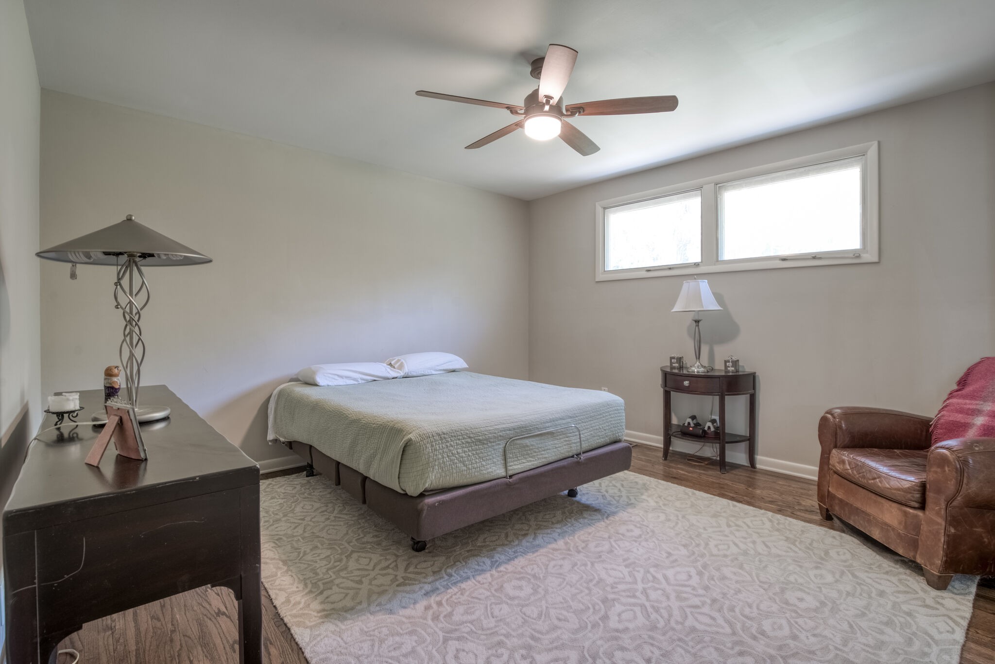 4134 West Hamilton Road Nashville, TN 37218 - Photo 21 of 35 a bedroom with a bed a couch and a potted plant