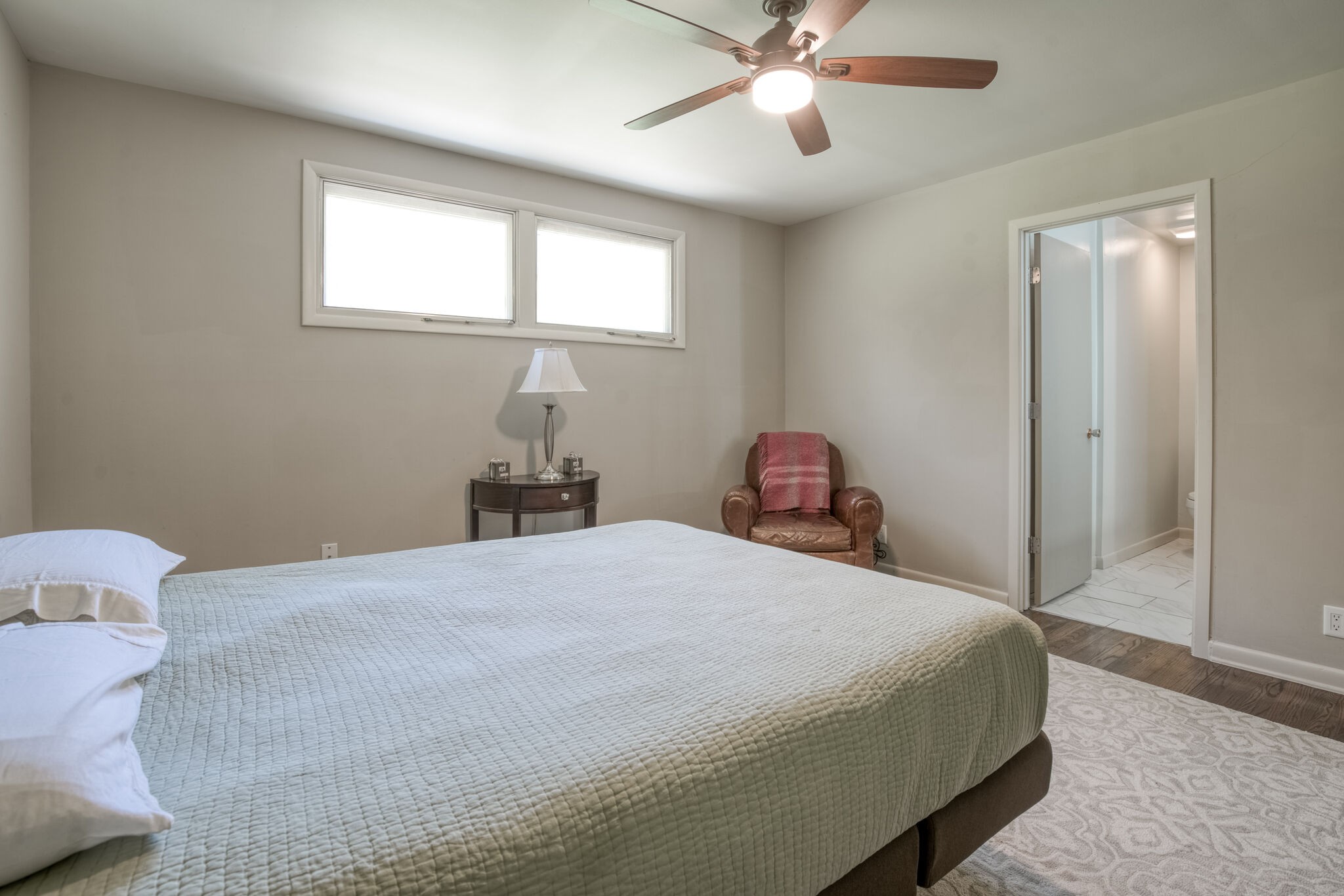 4134 West Hamilton Road Nashville, TN 37218 - Photo 23 of 35 a bedroom with a bed and a chandelier