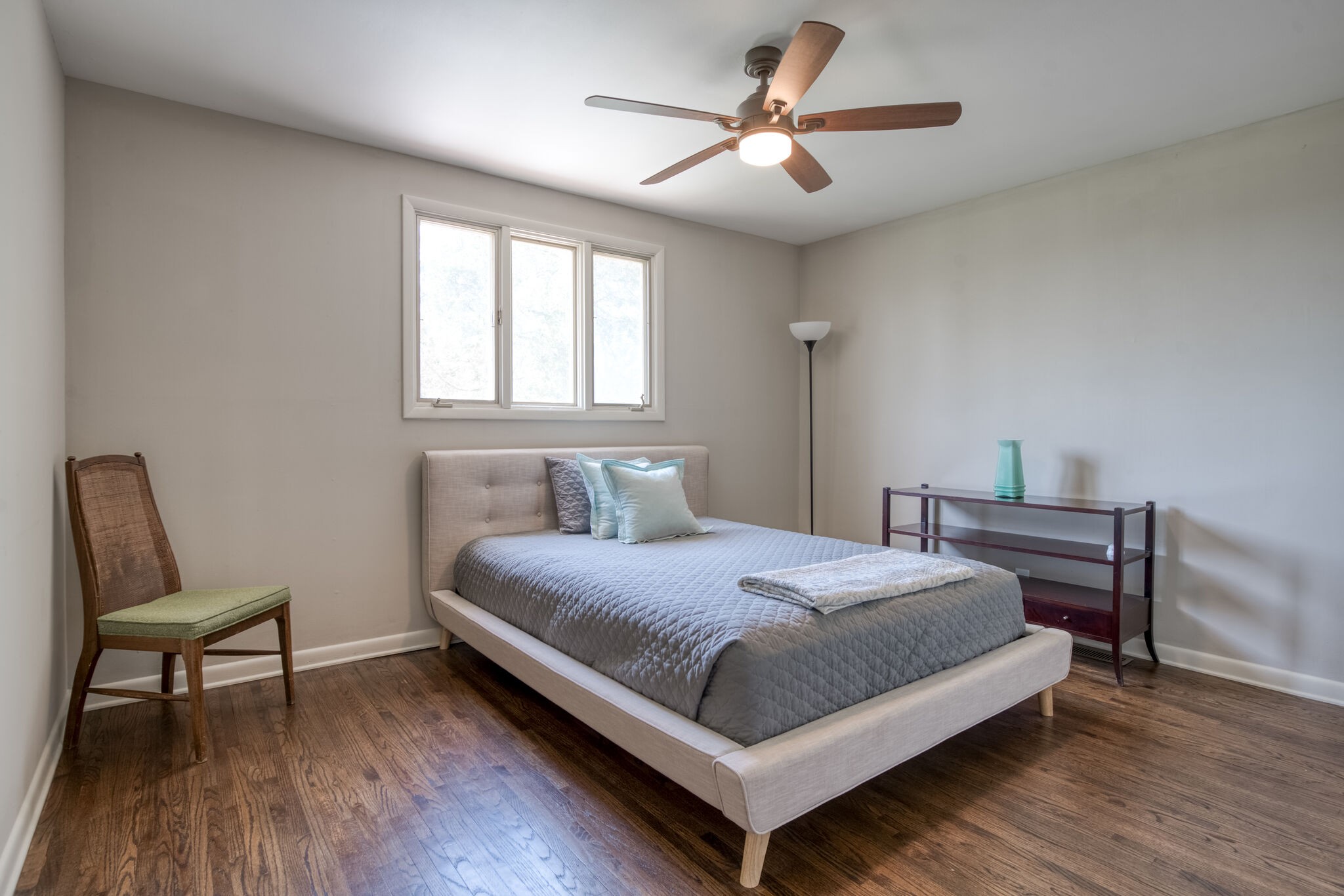 4134 West Hamilton Road Nashville, TN 37218 - Photo 25 of 35 a bedroom with a bed a chair and a potted plant on a dresser