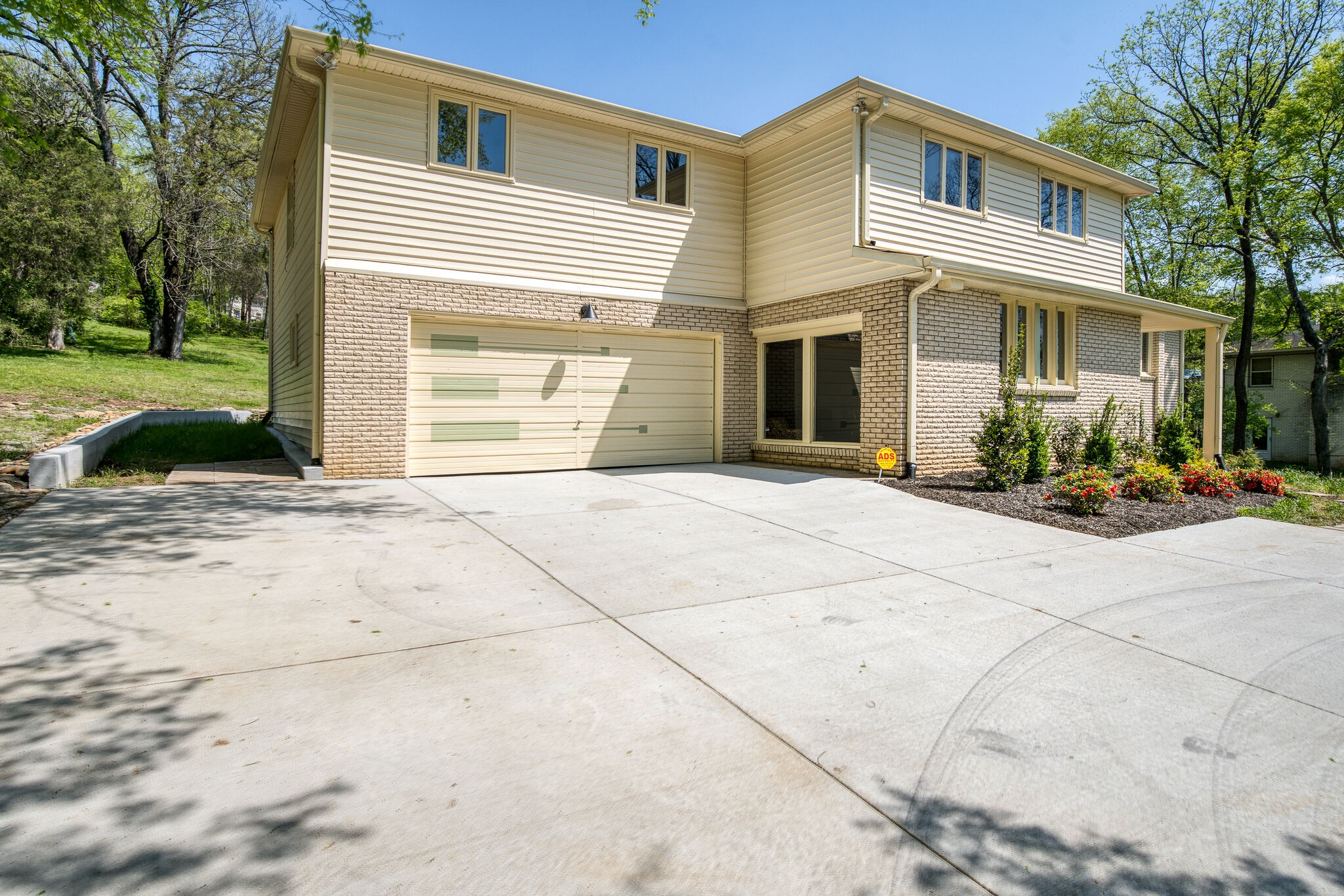 4134 West Hamilton Road Nashville, TN 37218 - Photo 3 of 35 a front view of a house with a yard and garage