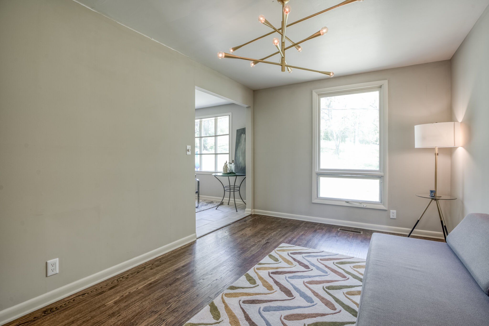 4134 West Hamilton Road Nashville, TN 37218 - Photo 9 of 35 a view of an empty room with a window and wooden floor