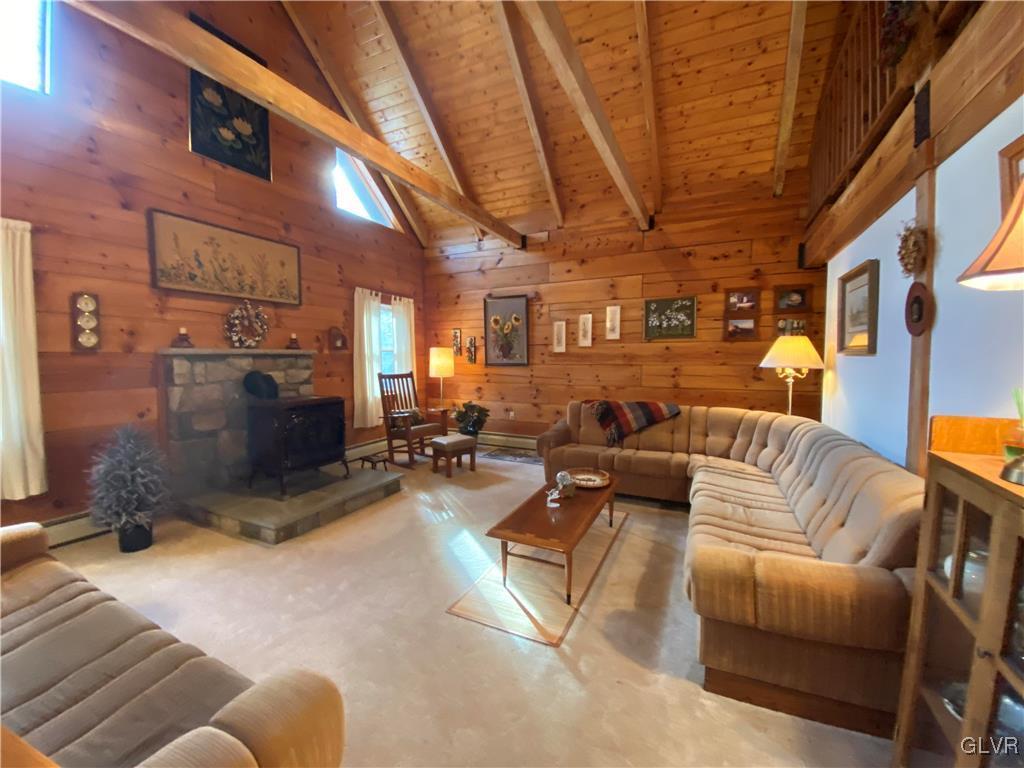 103 Antler Road Bartonsville, PA 18321 - Photo 11 of 32 a living room with furniture a couch and a chandelier