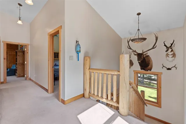 a view of a hallway with windows and entryway