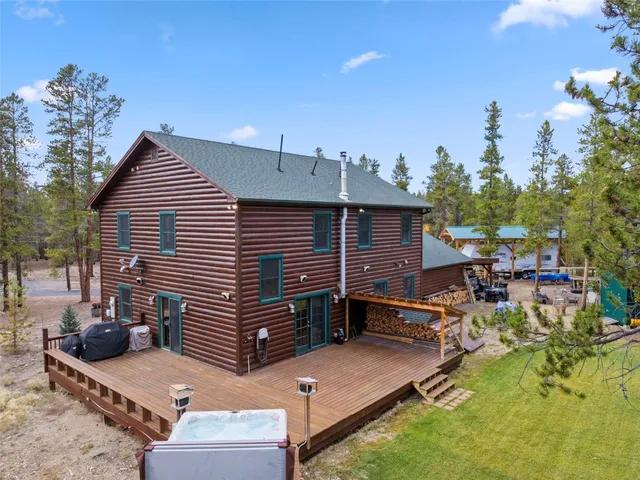 a view of house with outdoor space and sitting area