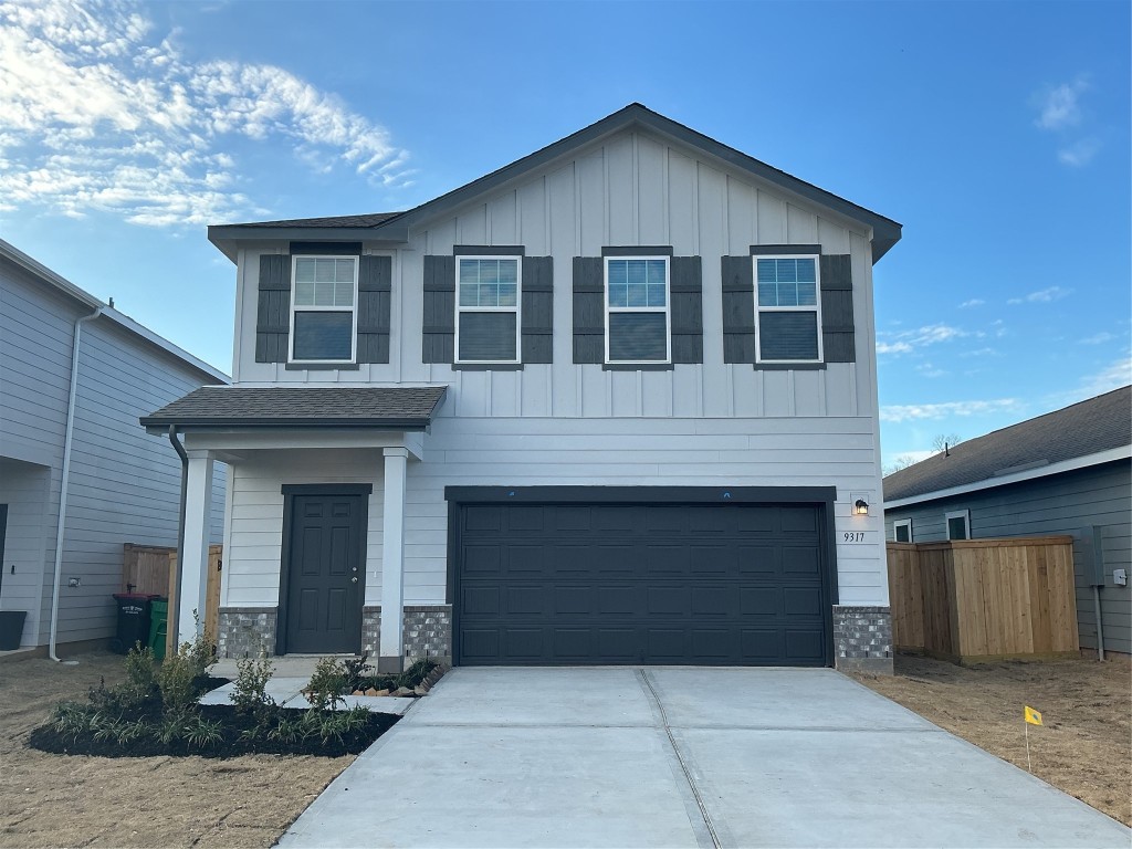 9317 Beryl Lane Conroe, TX 77303 - Photo 1 of 10 a front view of a house with yard