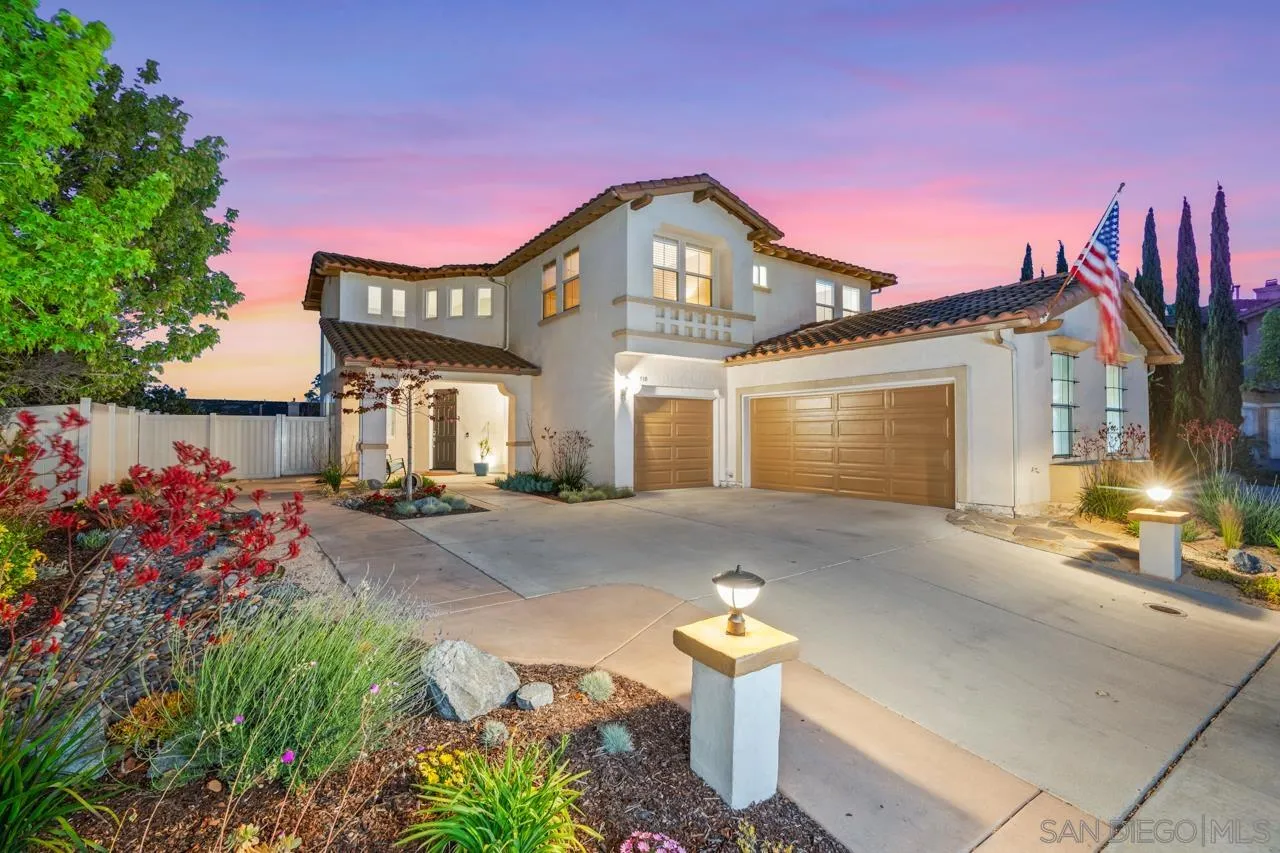 930 Merced River Road Chula Vista, CA 91913 - Photo 1 of 67 a front view of a house with a yard and a garage