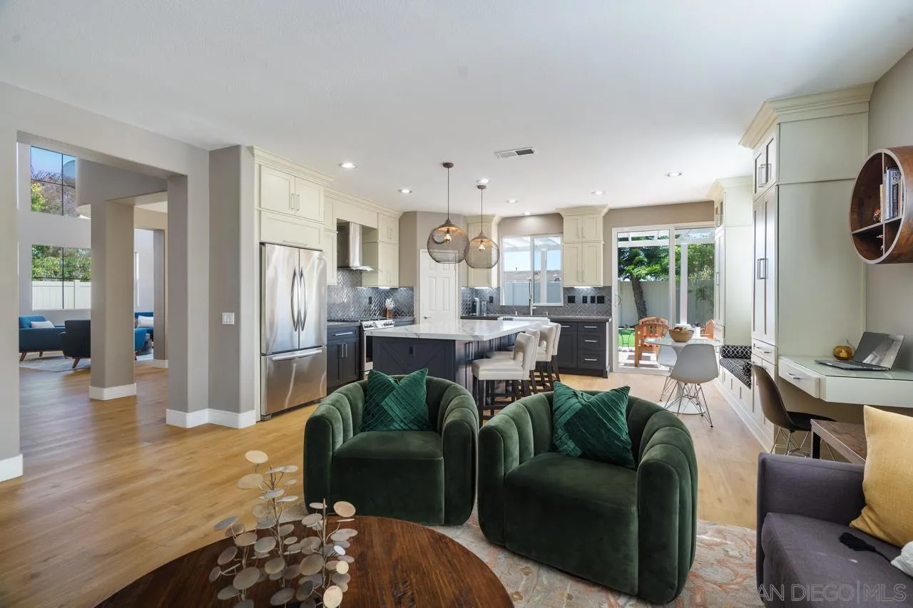 930 Merced River Road Chula Vista, CA 91913 - Photo 19 of 67 a living room with furniture a large window and a flat screen tv