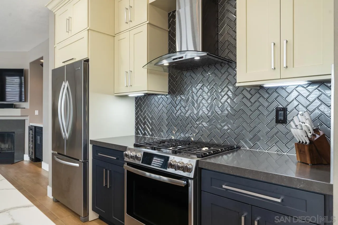 930 Merced River Road Chula Vista, CA 91913 - Photo 27 of 67 a kitchen with stainless steel appliances granite countertop a refrigerator and a stove