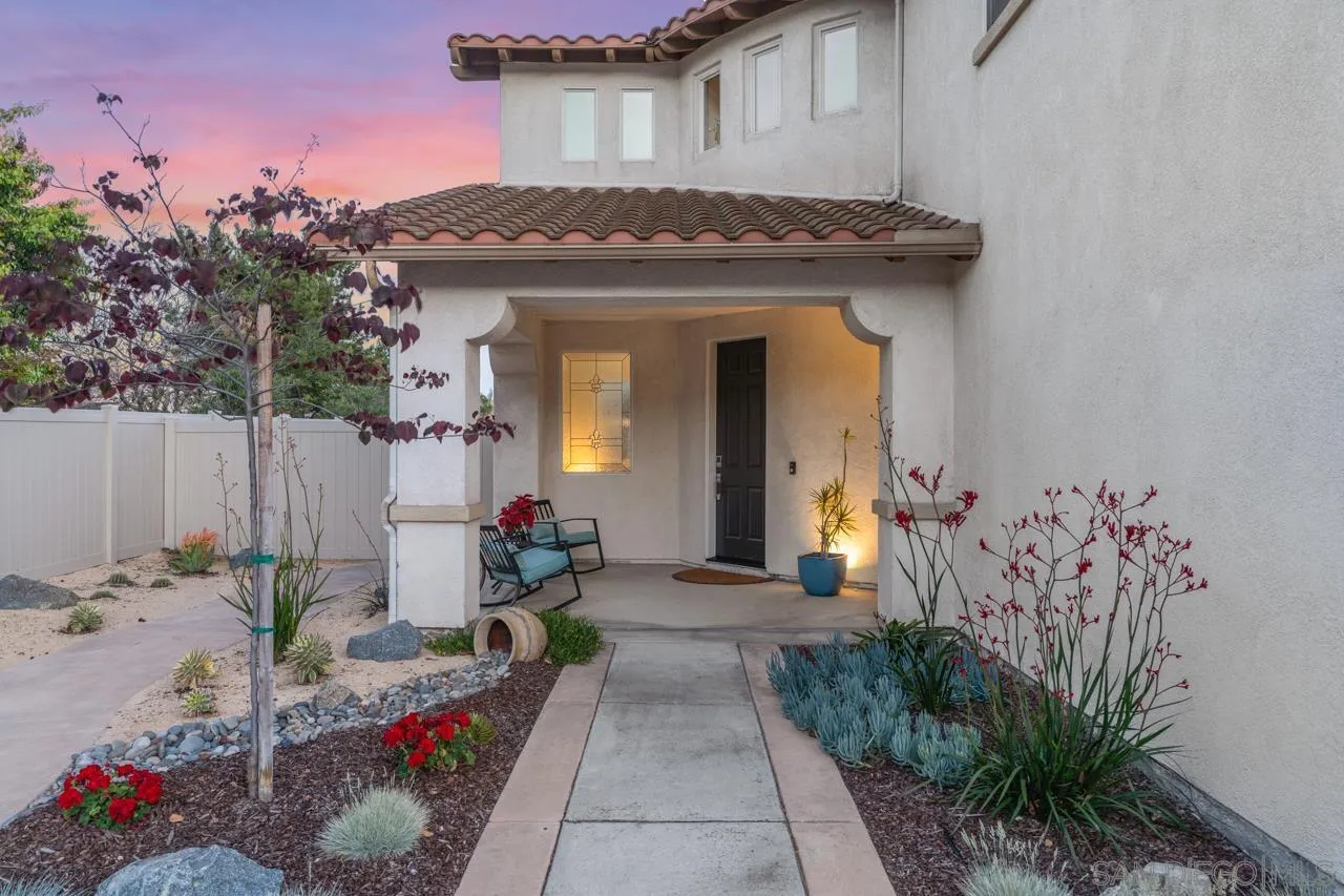 930 Merced River Road Chula Vista, CA 91913 - Photo 3 of 67 a front view of a house with a flower garden