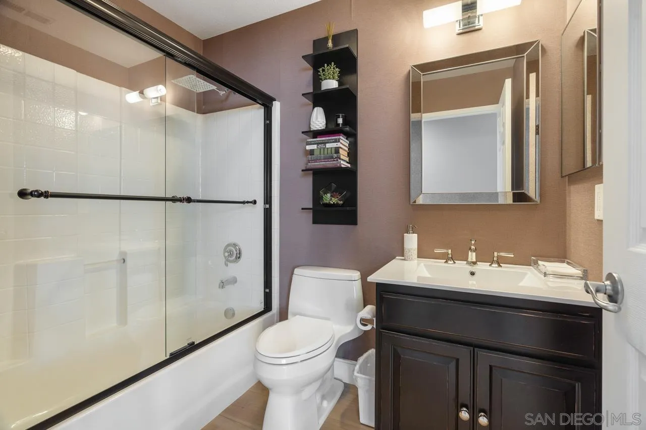 930 Merced River Road Chula Vista, CA 91913 - Photo 31 of 67 a bathroom with a sink vanity toilet and a mirror