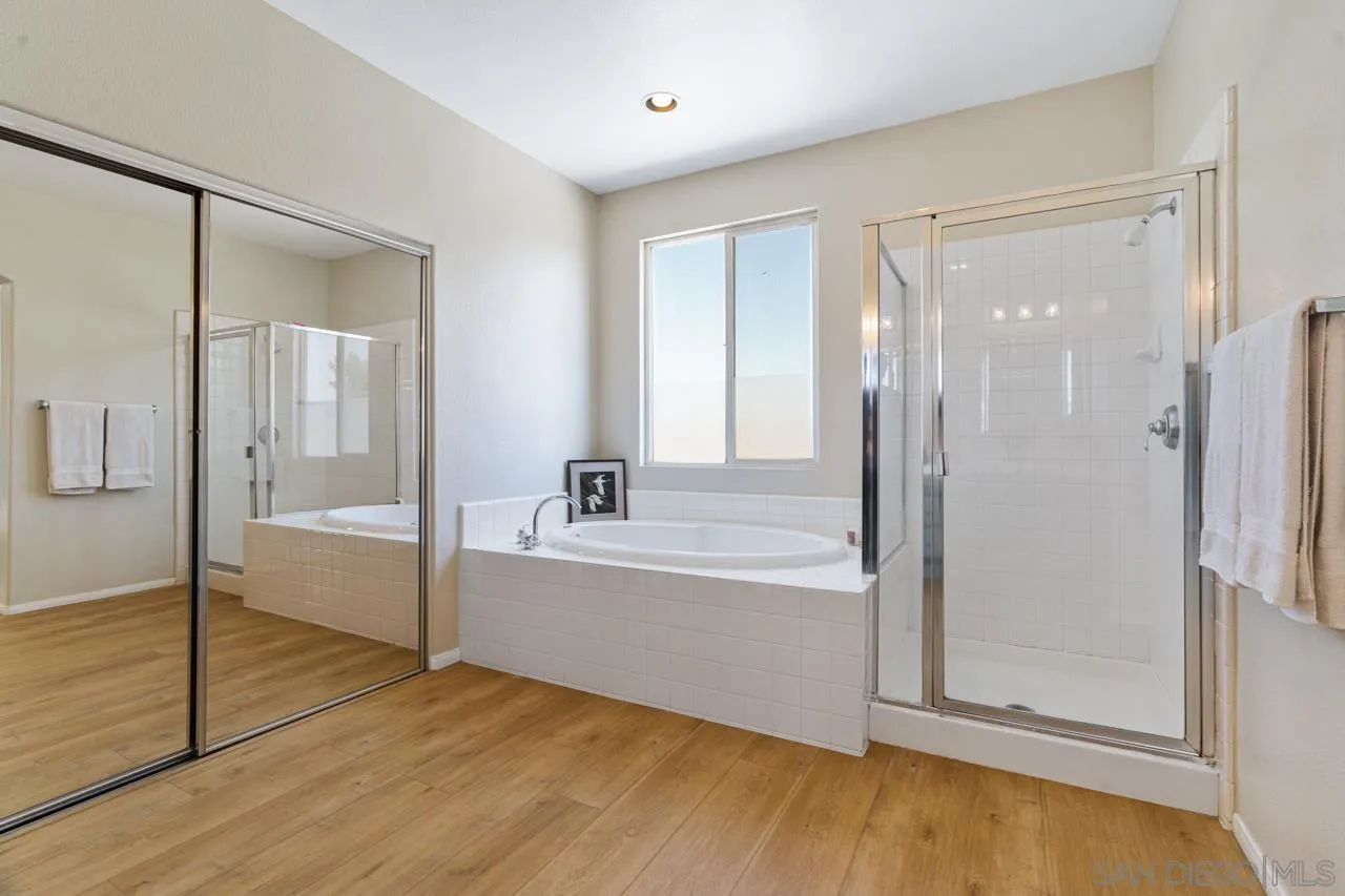 930 Merced River Road Chula Vista, CA 91913 - Photo 39 of 67 a spacious bathroom with a bathtub and a shower