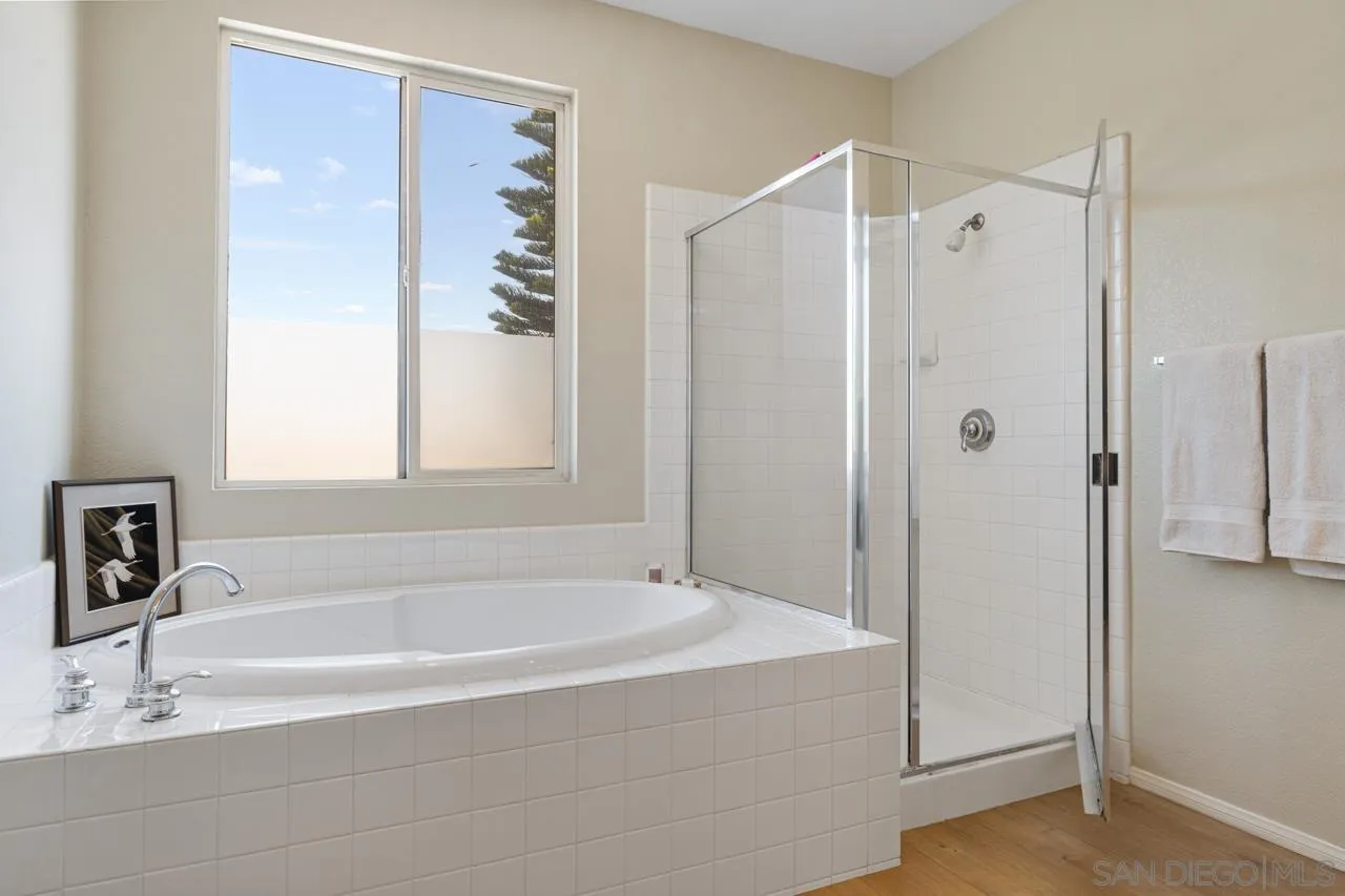 930 Merced River Road Chula Vista, CA 91913 - Photo 40 of 67 a white bath tub sitting next to a bathroom