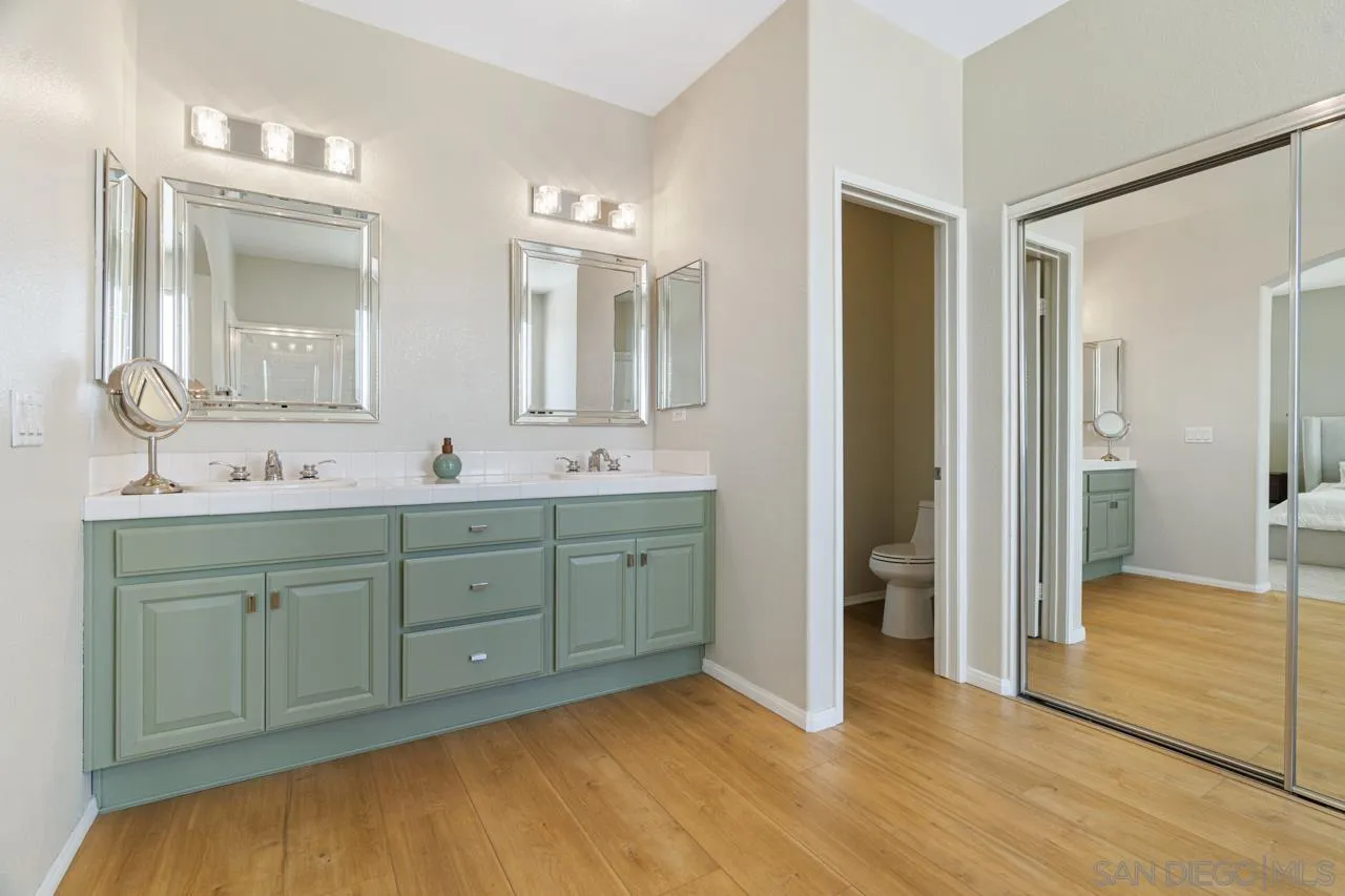 930 Merced River Road Chula Vista, CA 91913 - Photo 41 of 67 a spacious bathroom with double vanity and a mirror