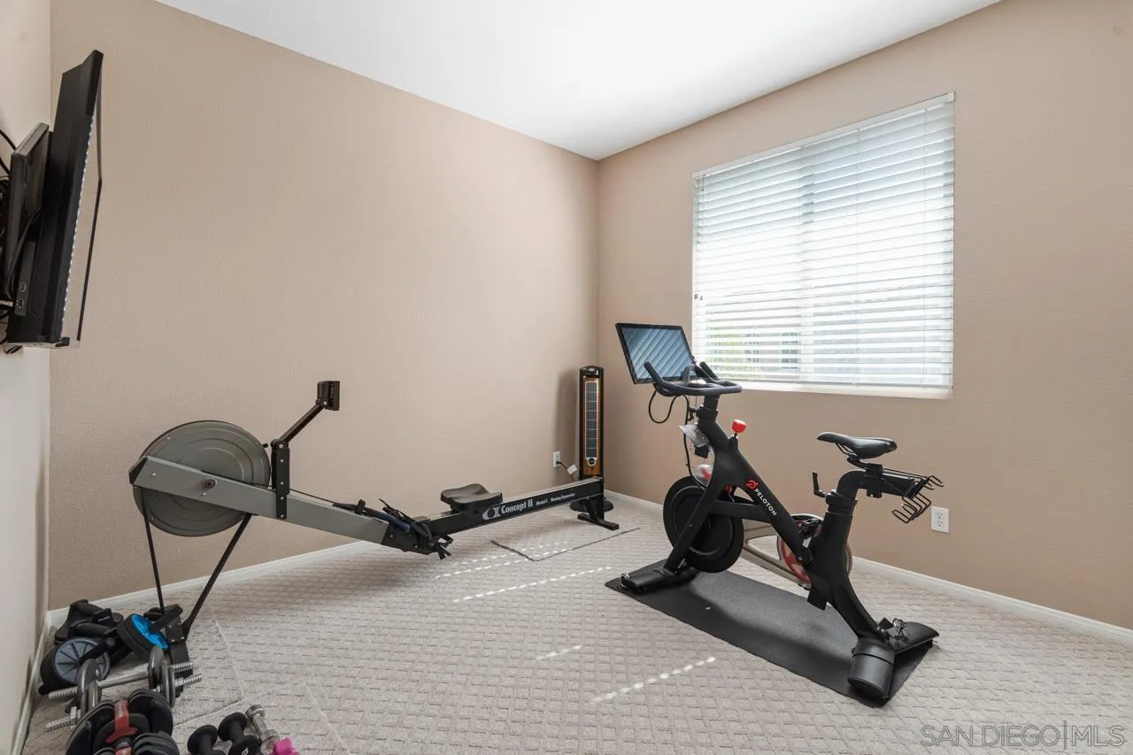 930 Merced River Road Chula Vista, CA 91913 - Photo 46 of 67 a room with gym equipment and windows