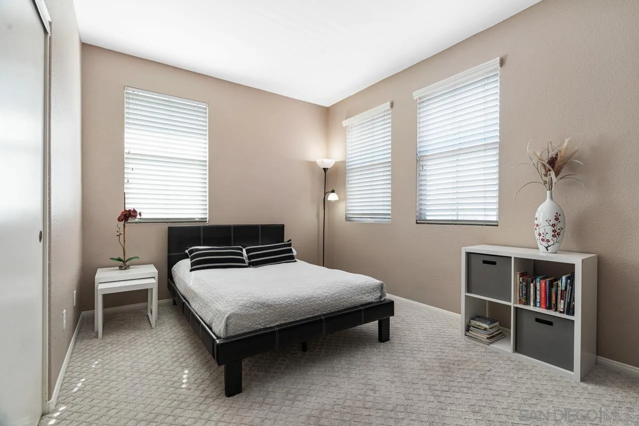 930 Merced River Road Chula Vista, CA 91913 - Photo 48 of 67 a bedroom with a bed and a table in it