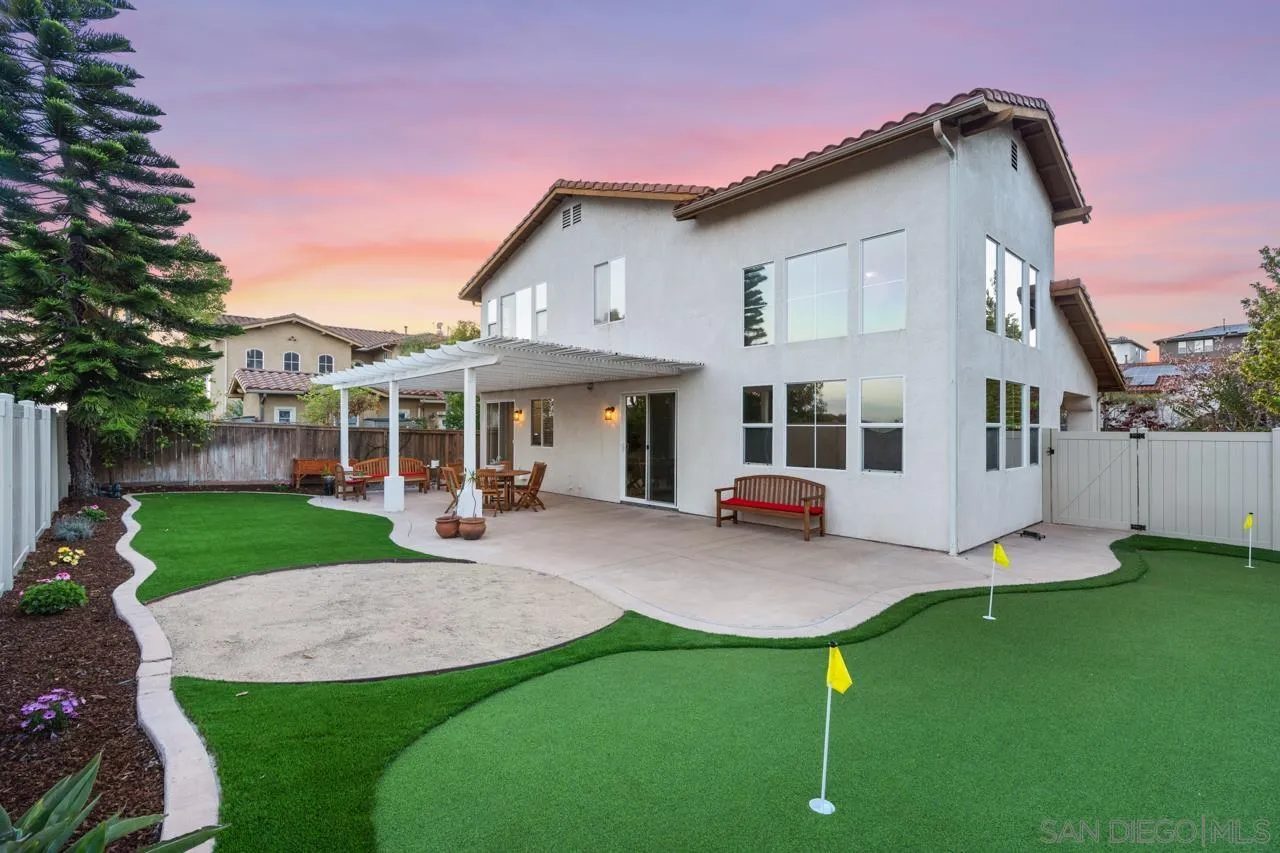930 Merced River Road Chula Vista, CA 91913 - Photo 53 of 67 a front view of a house with a yard table and chairs