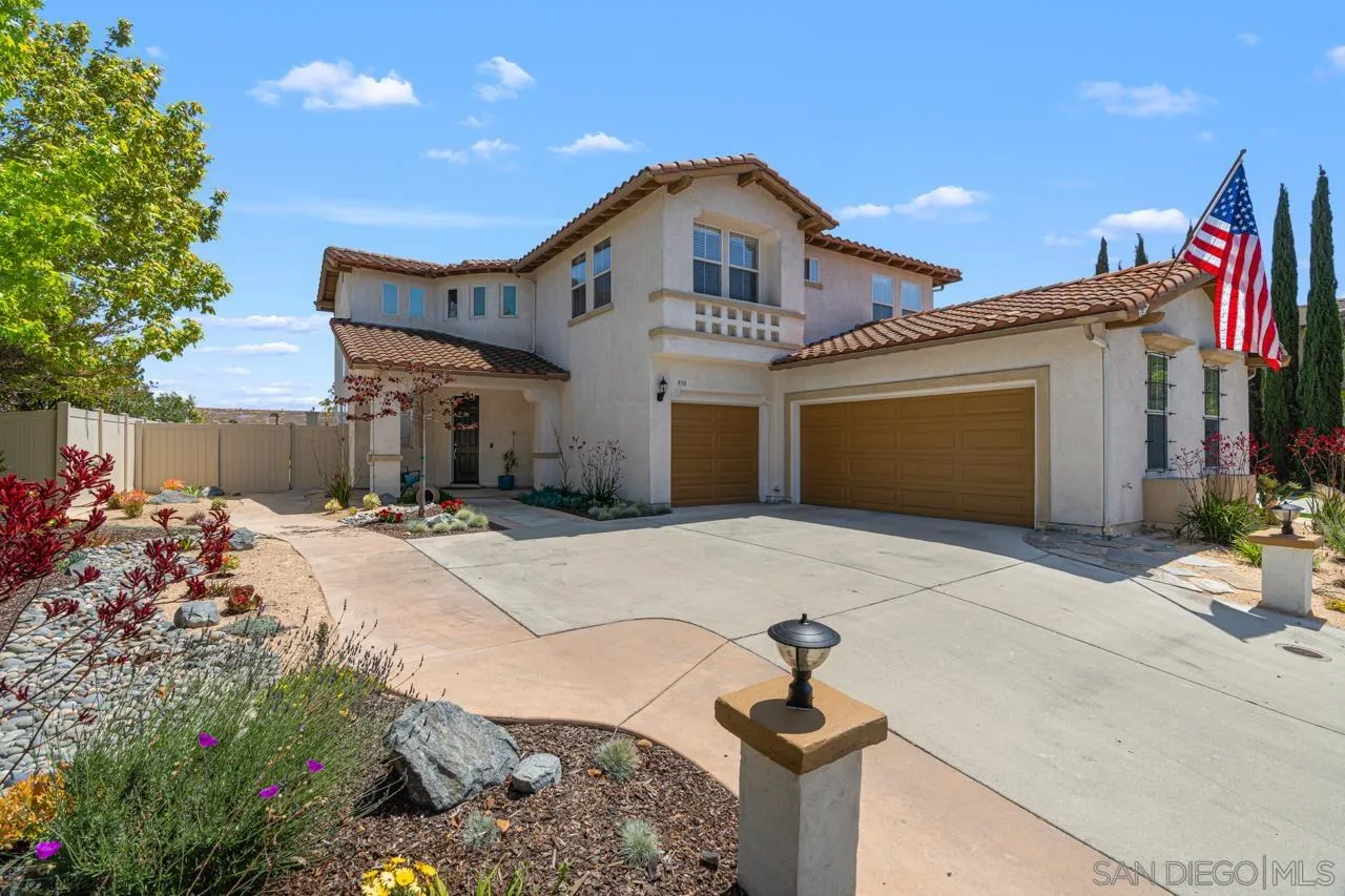 930 Merced River Road Chula Vista, CA 91913 - Photo 54 of 67 a front view of a house with a yard and garage