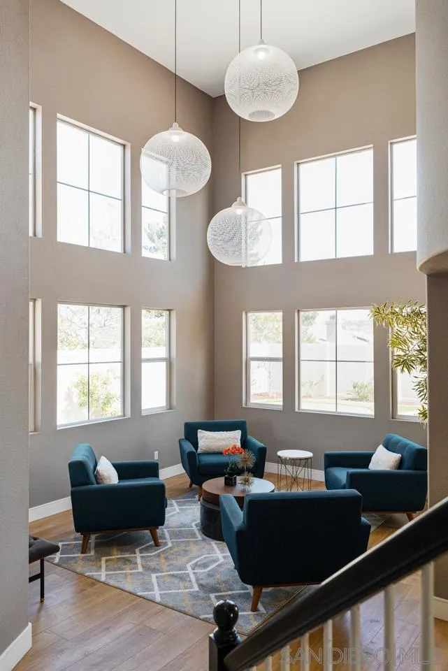 930 Merced River Road Chula Vista, CA 91913 - Photo 7 of 67 a living room with furniture two window and wooden floor