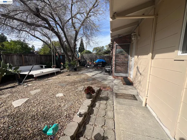 a view of yard with patio