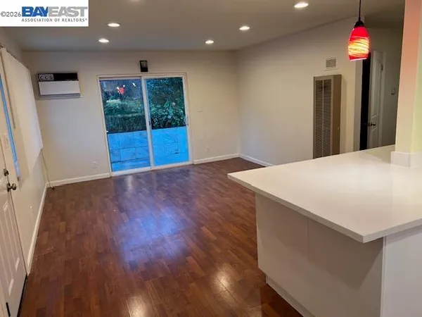 a view of hallway with wooden floor