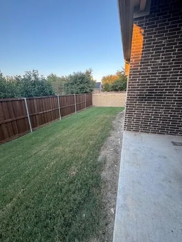 a view of backyard with green space
