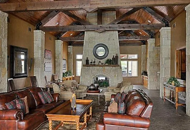 a living room with furniture and a clock